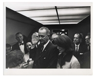 Cecil W. Stoughtons Personal, Unpublished Photo of LBJs Inauguration Aboard Air Force One -- LBJ Takes the Oath of Office as Jackie Stands Witness